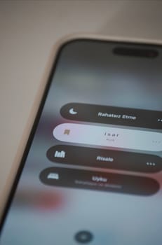 Close-up of a smartphone screen displaying app interface with text in Turkish.